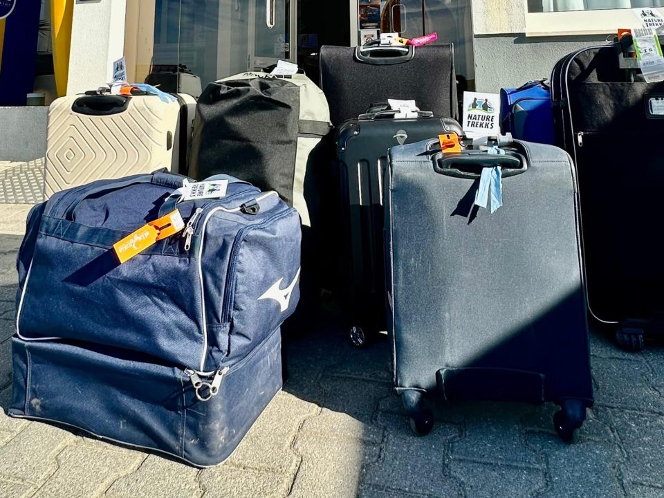 Backpacks and suitcases arranged for luggage transfer service on the Fisherman's Trail and Rota Vicentina by Nature Trekks.